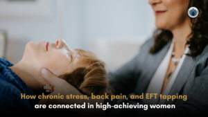 High-achieving woman in real estate experiencing back pain while working, exploring EFT tapping techniques for stress relief and nervous system regulation.